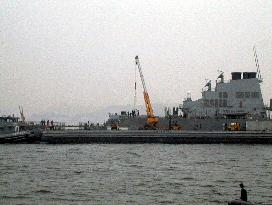 Missiles appear to be loaded on U.S. warship at Yokosuka base